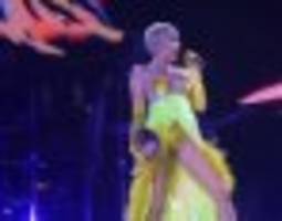 Miley Cyrus Throws Weird Cutout Of Selena Gomez Around While Singing 'FU'